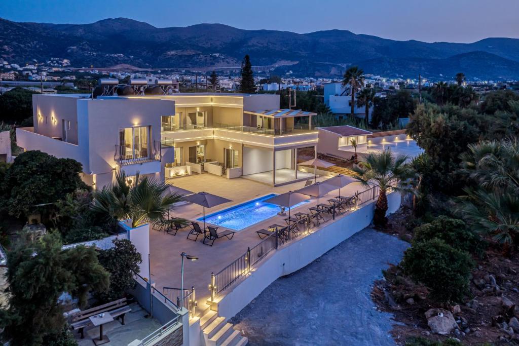 an aerial view of a house with a swimming pool at Amara Cove Adults Only by Estia in Malia