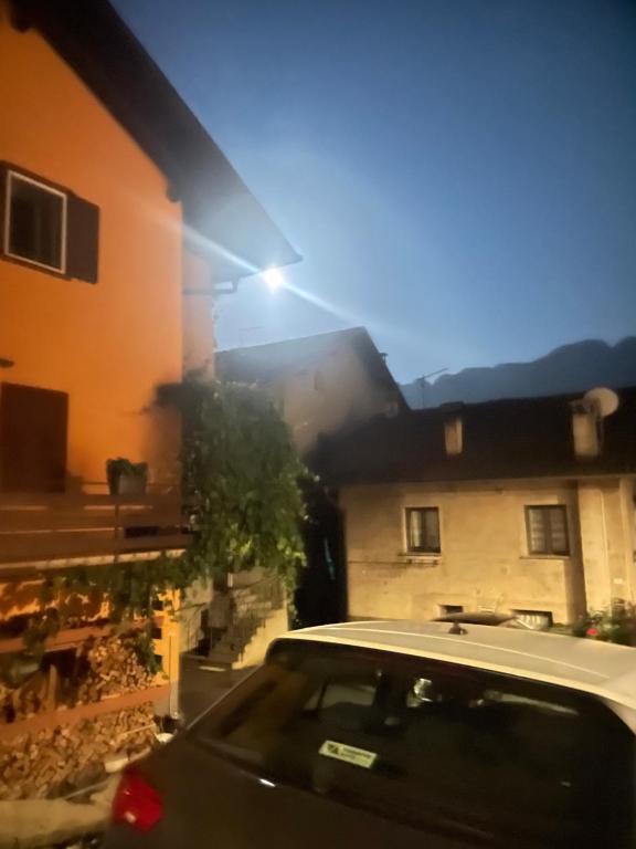 a car parked in front of a house at Al Vicolo in Telve