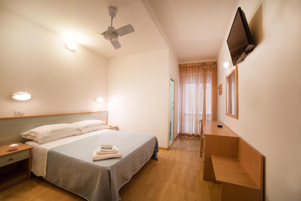Postel nebo postele na pokoji v ubytování Hotel Augusta