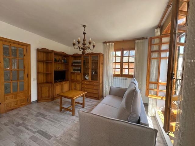 a living room with a couch and a table at Casa Lobo in Ucero