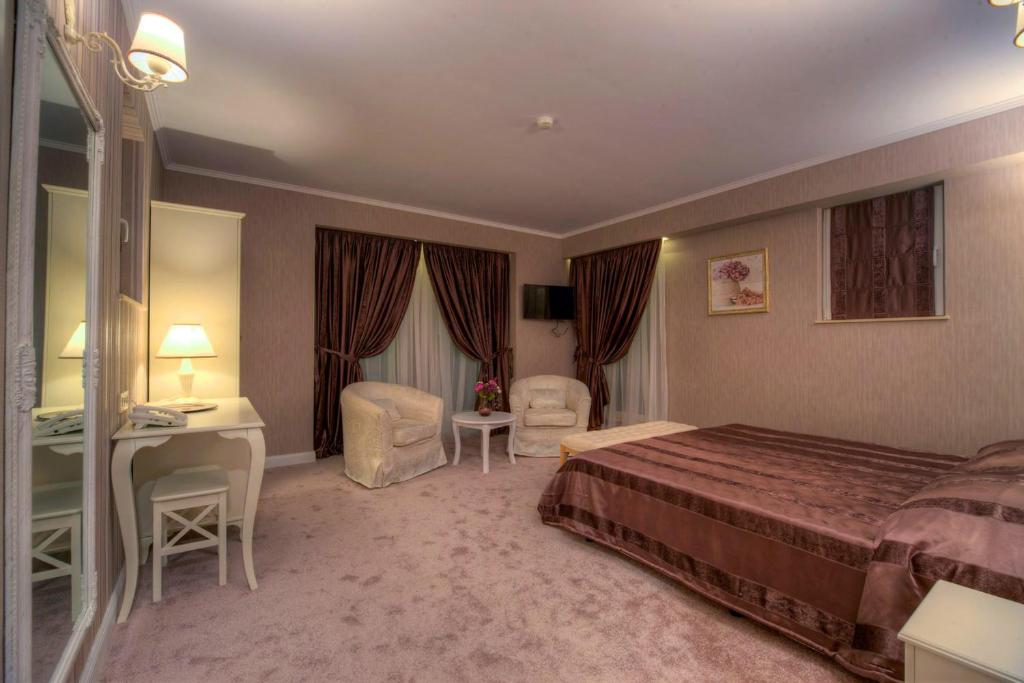 Postel nebo postele na pokoji v ubytování Family Hotel Agoncev