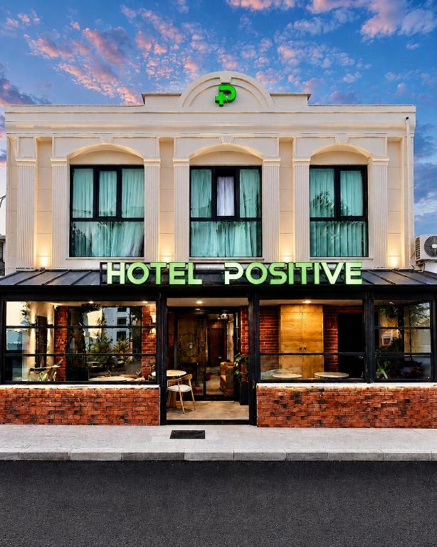 a hotel post office building with a sign on it at Positive Hotel in Arnavutköy