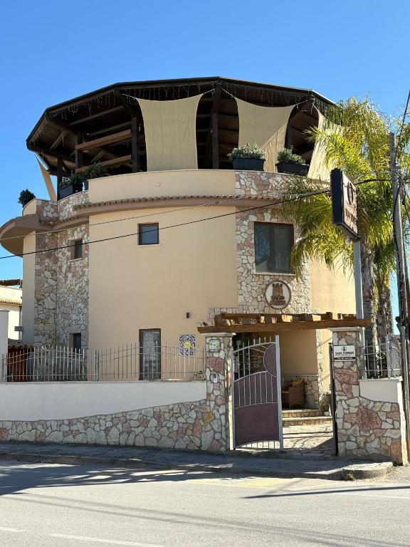 a building with a door on the side of a street at Sun Tower beach apartments in Mazara del Vallo