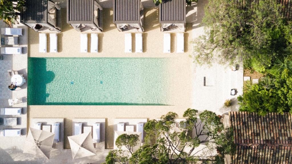 an overhead view of a swimming pool in a building at MUSE Saint Tropez - Small Luxury Hotels of the World in Saint-Tropez