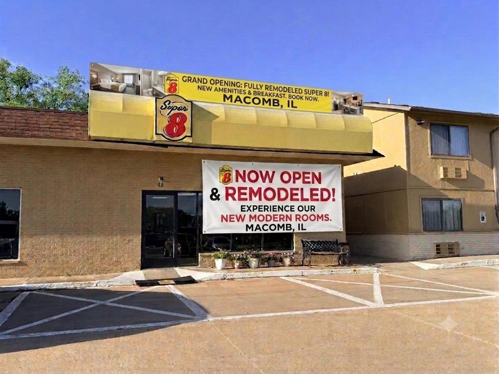 a building with a new open and renovated sign on it at Super 8 by Wyndham Macomb in Macomb