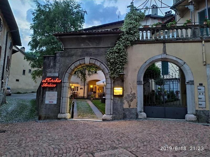 an entrance to a building with two arches at La Locanda del Viandante in Mendrisio