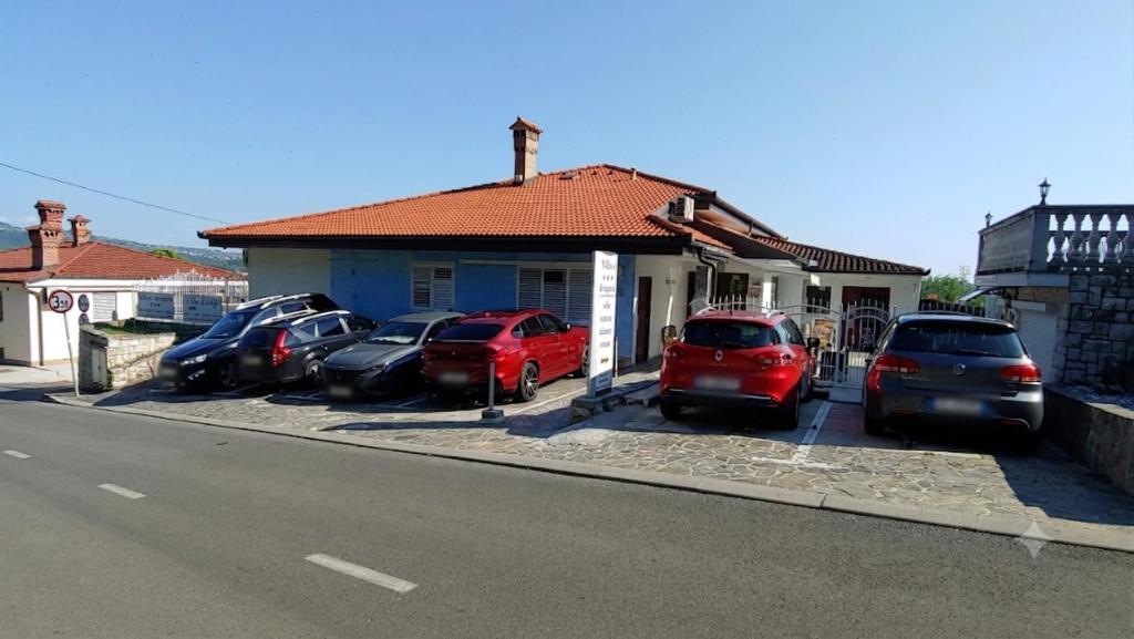 a group of cars parked in front of a house at Villa Senegačnik in Portorož