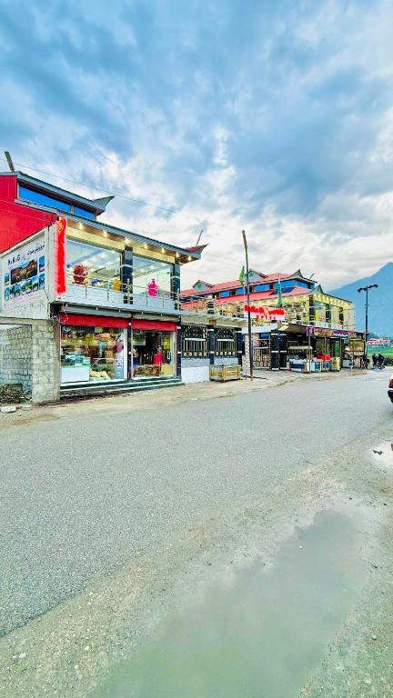 a group of shops on the side of a street at Kaka G Hotel Utror Valley in Utrot