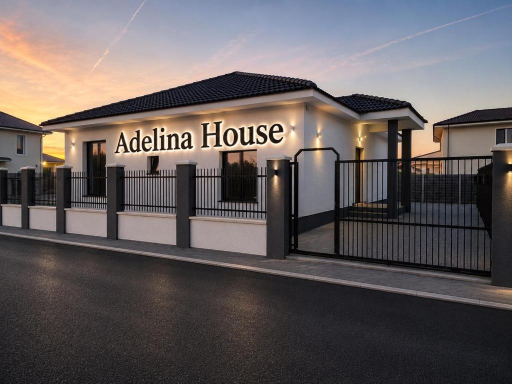 aania house sign on the side of a building at Adelina House in Remetea Mare