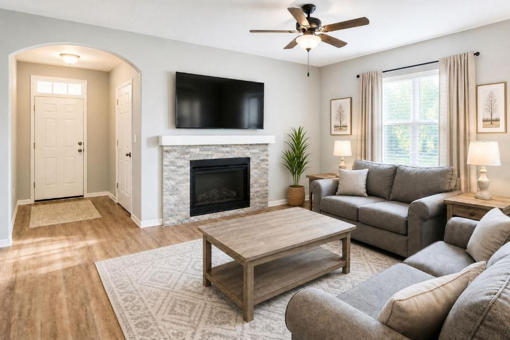 a living room with a couch and a fireplace at Alpine Haven Getaway in Vail