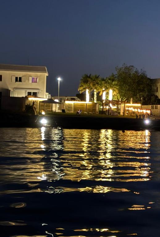 a view of a body of water at night at Bari Sea Paradise View in Bari