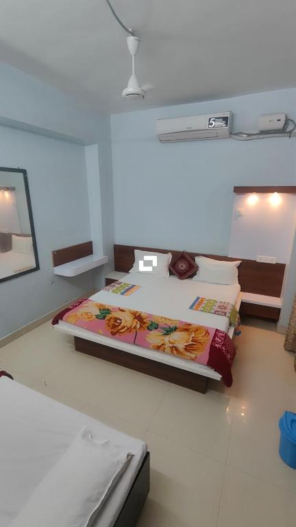 a bedroom with a bed in a room at Hotel adiraj palace exclusive in Ahmadnagar