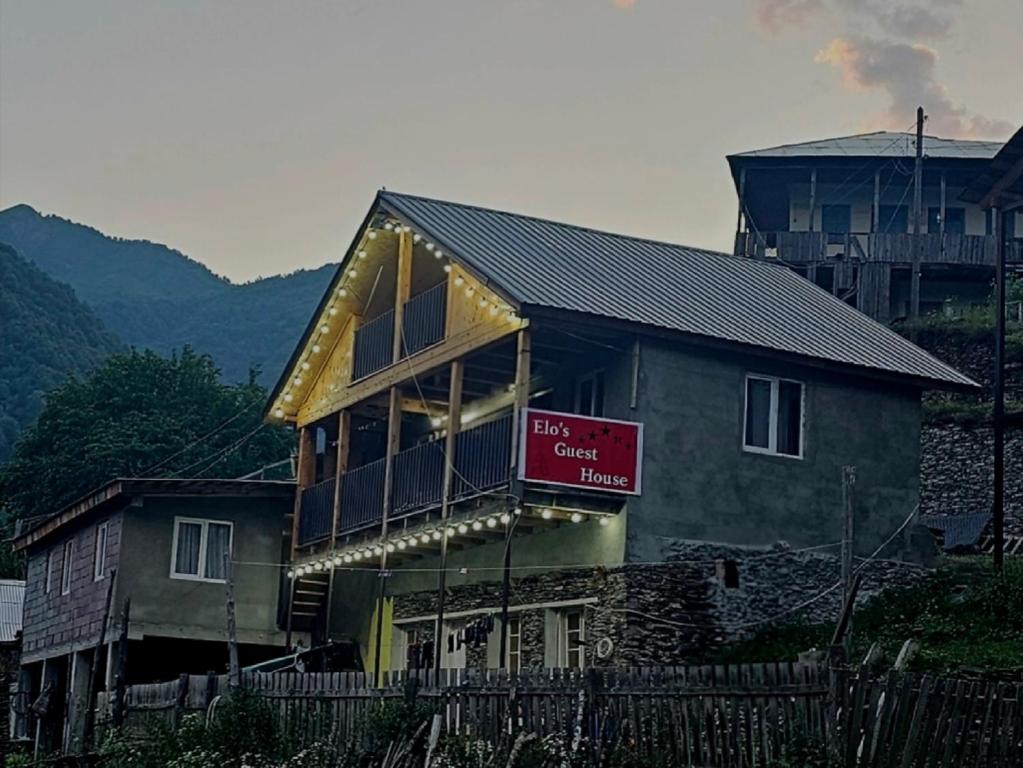 a house with a sign on the front of it at Elo's Guesthouse in Iprari