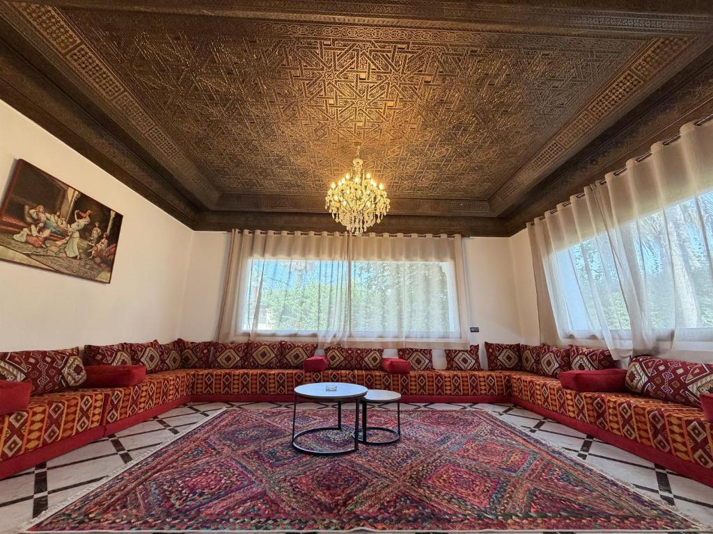 a living room with a couch and a table at Villa Anfa in Casablanca