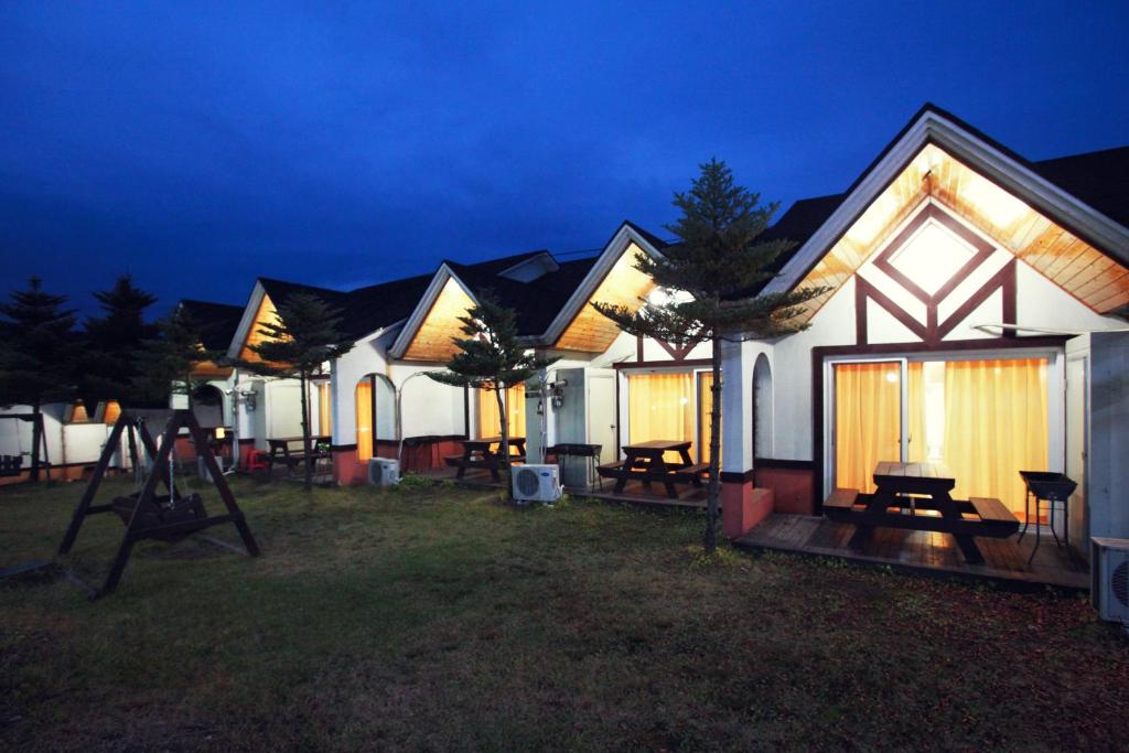 a row of houses lit up at night at Pyeongchang Hyundai Sweet Village in Pyeongchang