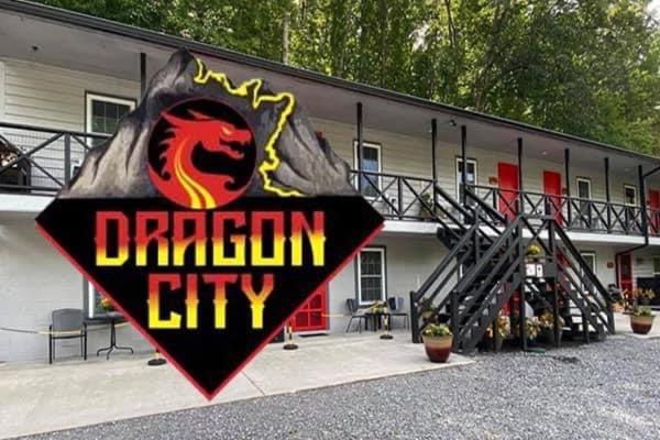 a dragon city sign in front of a building at Dragon City in Maryville