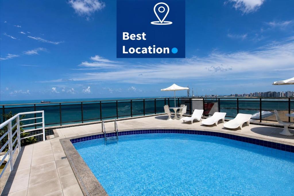 a swimming pool on the roof of a building at Atlantic Ocean Residence in Fortaleza