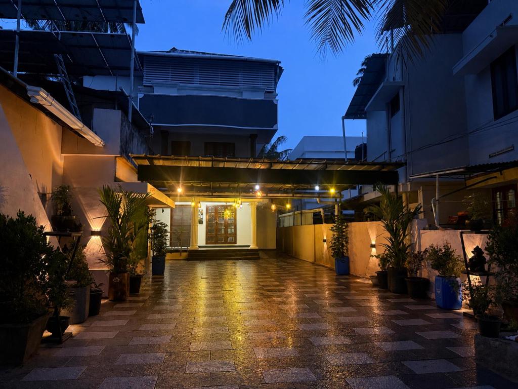 an empty courtyard of a building at night at The Villa Mahogany in Trivandrum