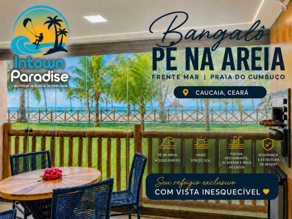 a table and chairs in a restaurant with a sign at Bungalow Frente Mar N 101 in Caucaia