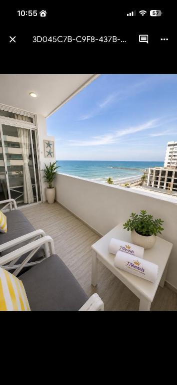 a balcony with beds and a view of the ocean at Getaway at Fragata Style with Ocean View in Cartagena de Indias