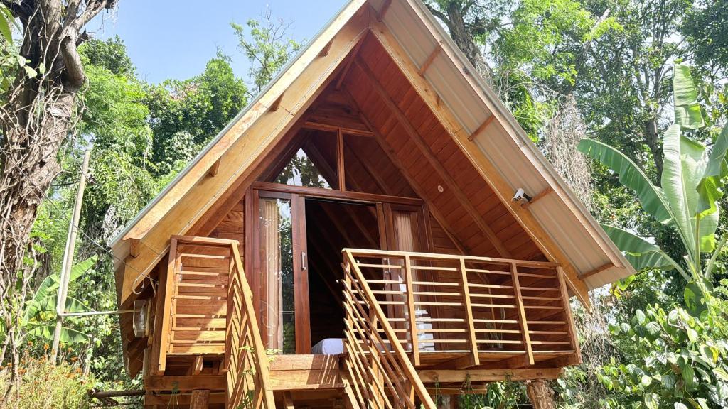 a small tree house with a porch and two stairs at Nature Bliss Ella in Ella