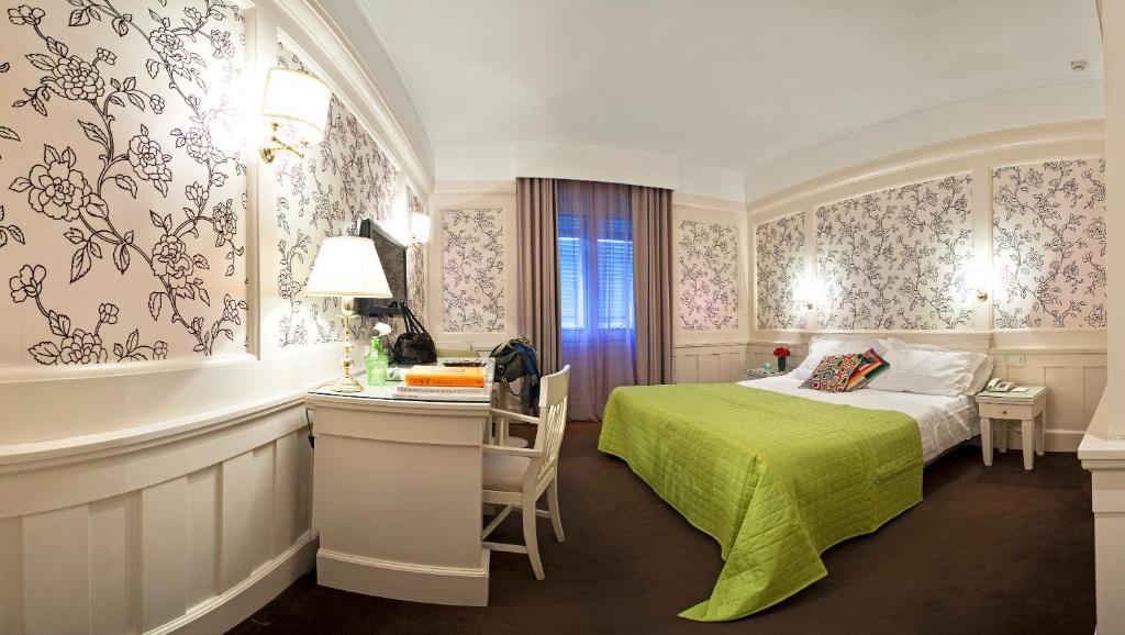 Postel nebo postele na pokoji v ubytování Europa Hotel Design Spa 1877