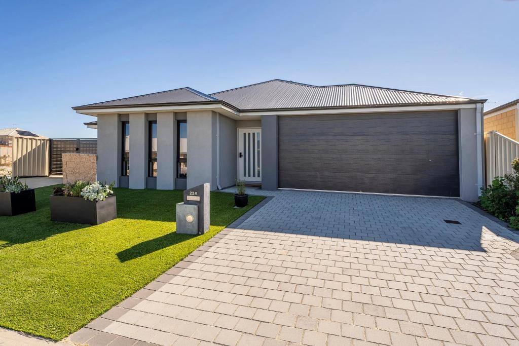 a rendering of a house with a garage at Your Beach Getaway in Singleton