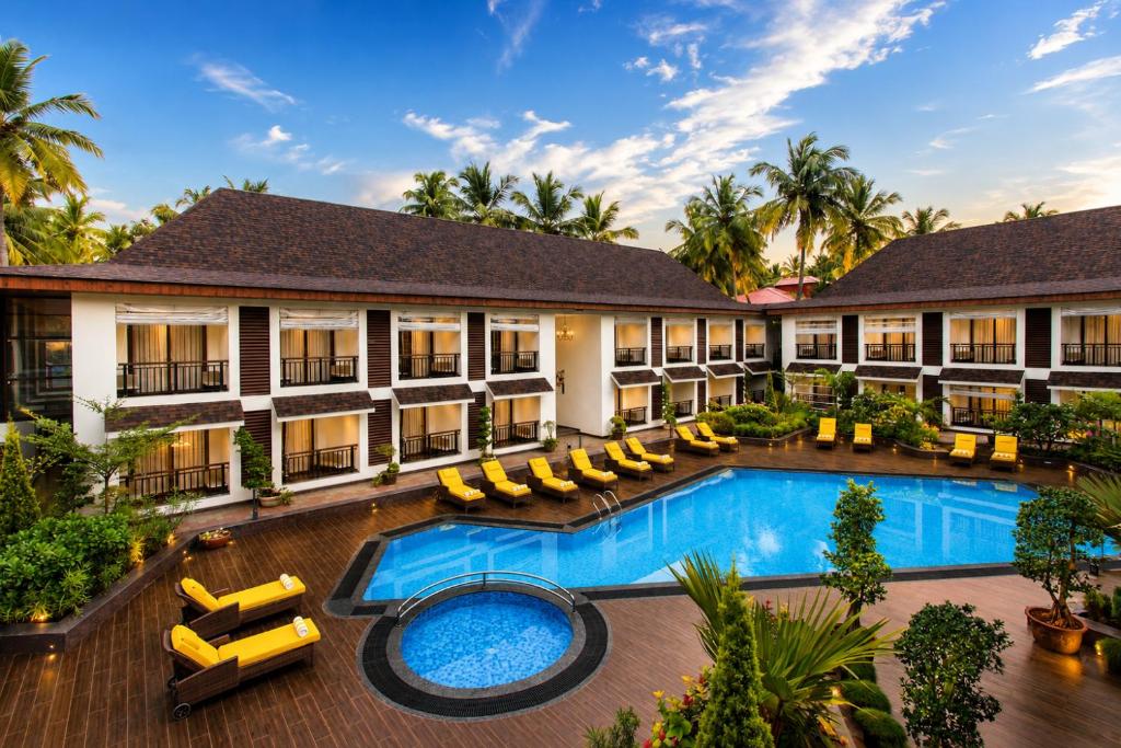 an aerial view of the courtyard of a resort with a swimming pool at Sobit Sarovar Portico in Palolem