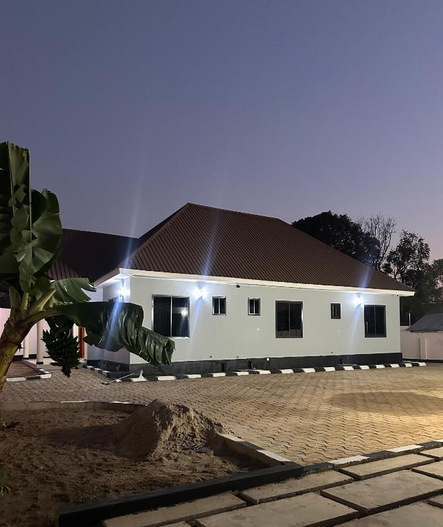 a large white building with lights on it at Ngara Sleasure in Songea