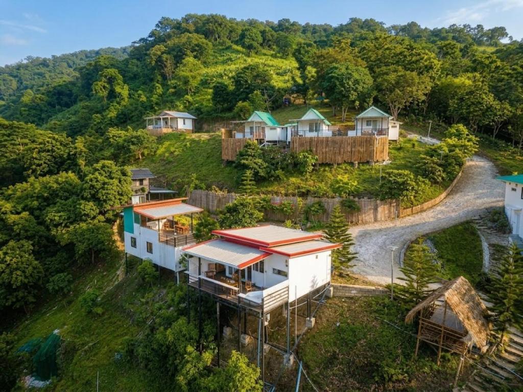 an aerial view of a house on a hill at Doi Lan Home stay ดอยล้านโฮมสเตย์ in Ban Huai Khai