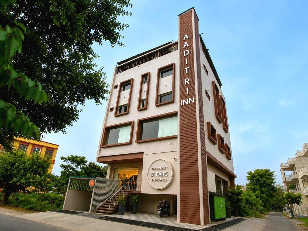 a building with a sign on the side of it at Aaditri Inn in Gorakhpur