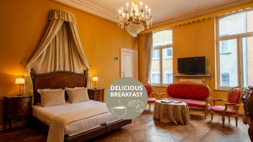a bedroom with a bed and a chandelier at Boutique Hotel Hancelot in Ghent