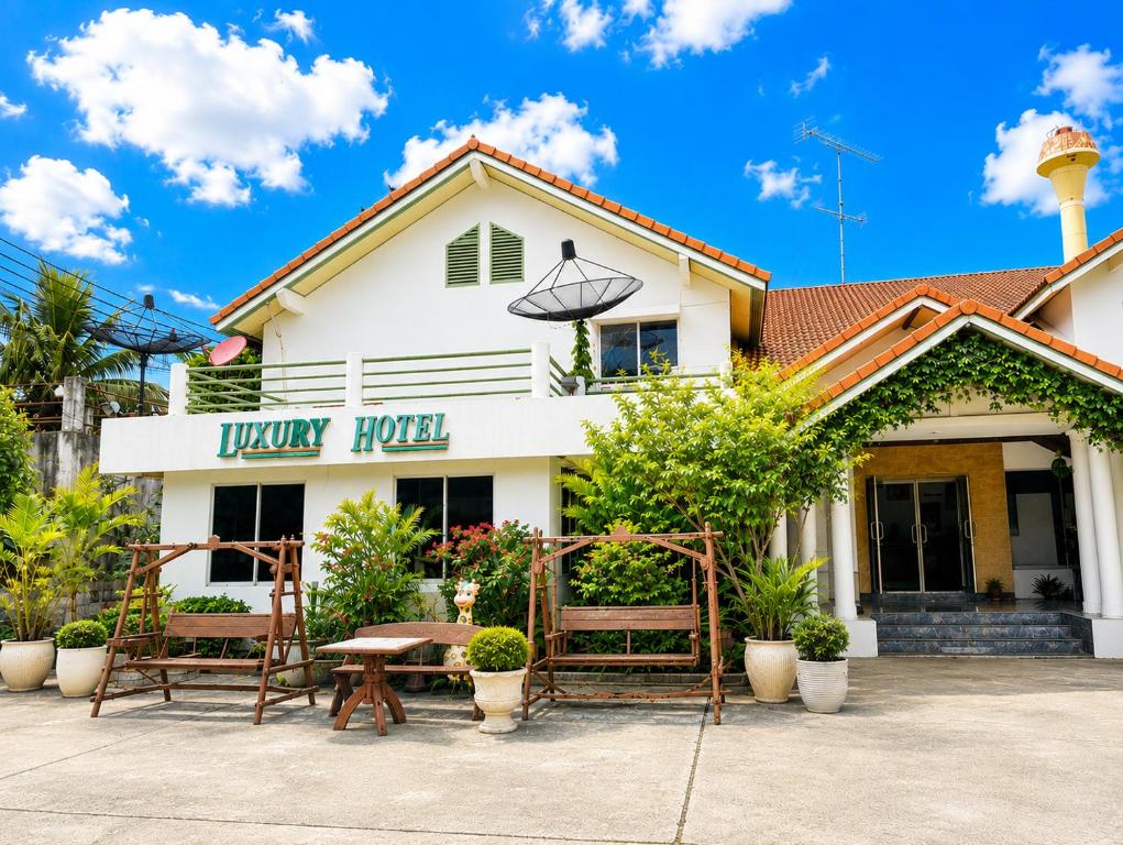 a white building with a sign that reads funky taco at Luxury Hotel ลักเซอรี่ โฮเทล in Ban Don Rak