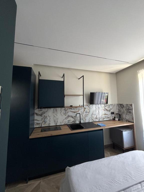 a kitchen with a sink and a counter top at Sulejmanasi Rooms in Vlorë