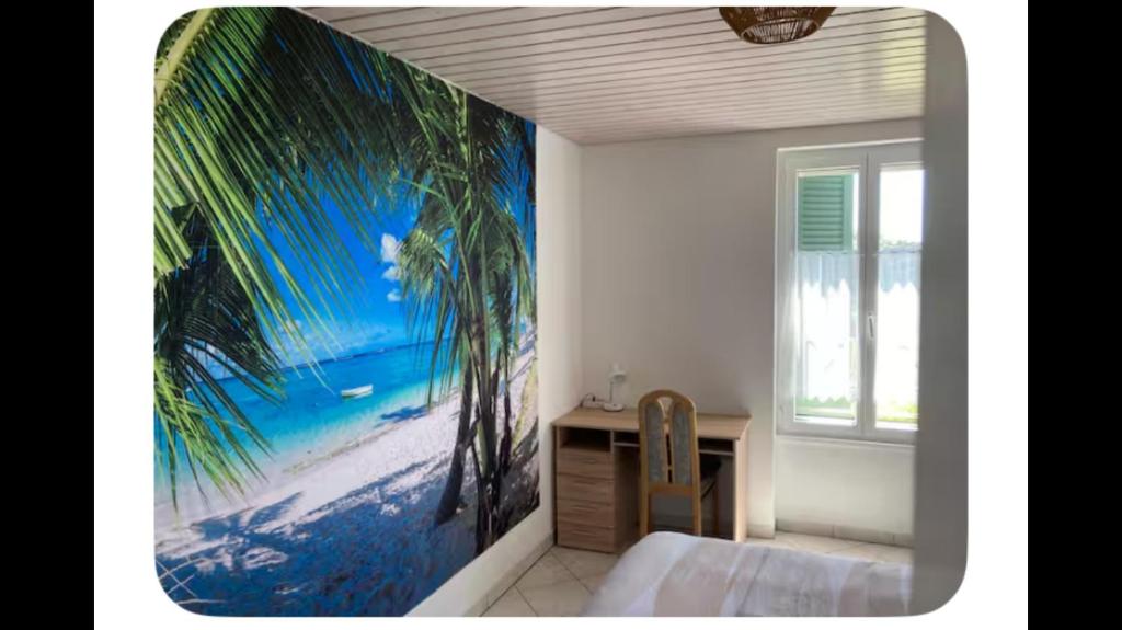 a bedroom with a large painting of palm trees on the wall at Zenitude in Goumoens-la-Ville