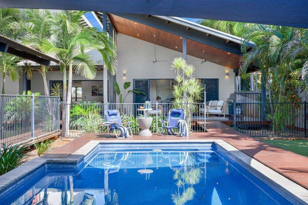 a swimming pool in front of a house at Jila Cable Beach in Cable Beach