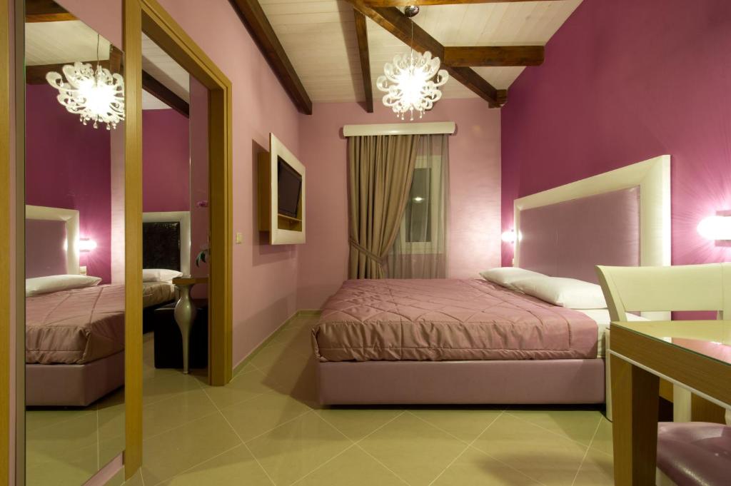 Postel nebo postele na pokoji v ubytování Ideal Boutique Hotel