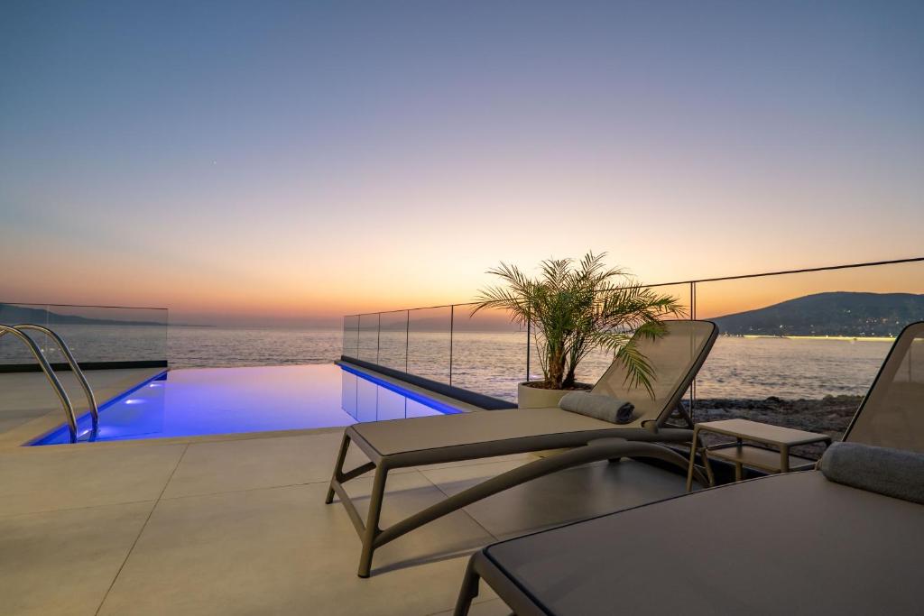 a living room with a view of the ocean at Nube Luxury Villas in Sarandë