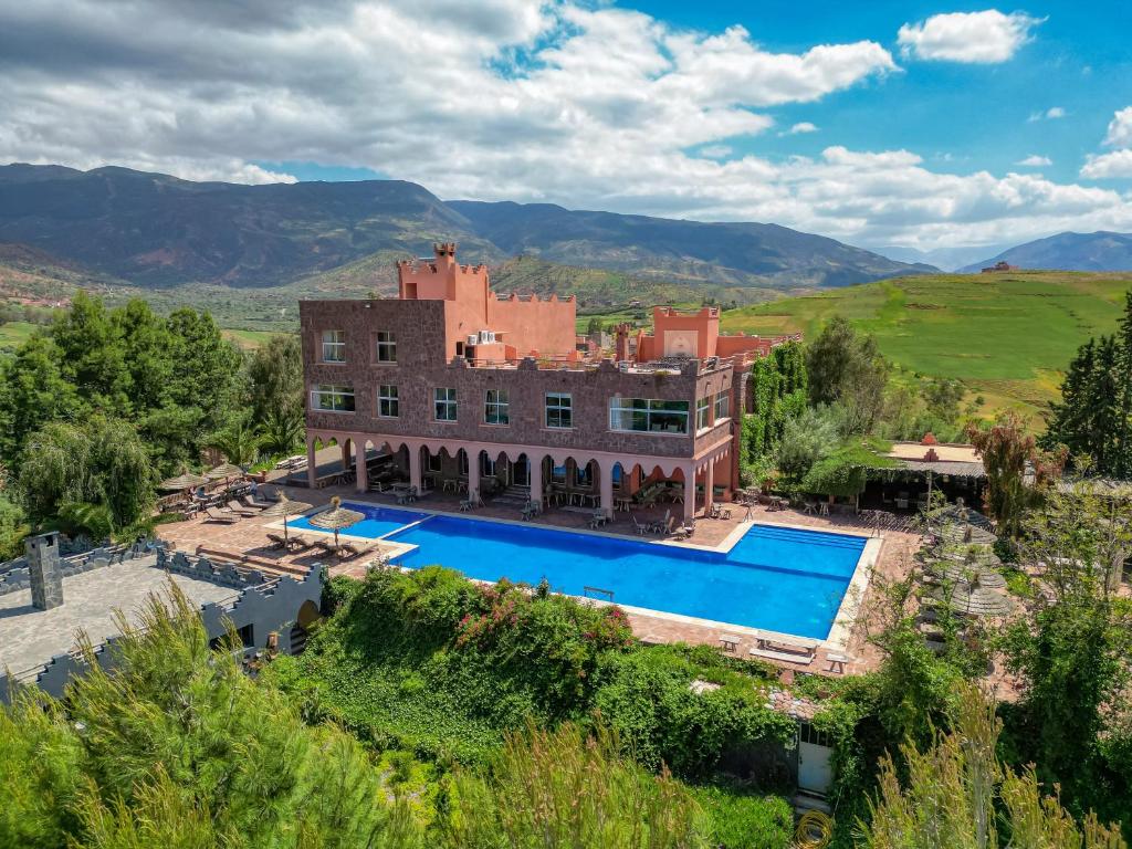 an aerial view of a house with a swimming pool at Diar illi in Touama