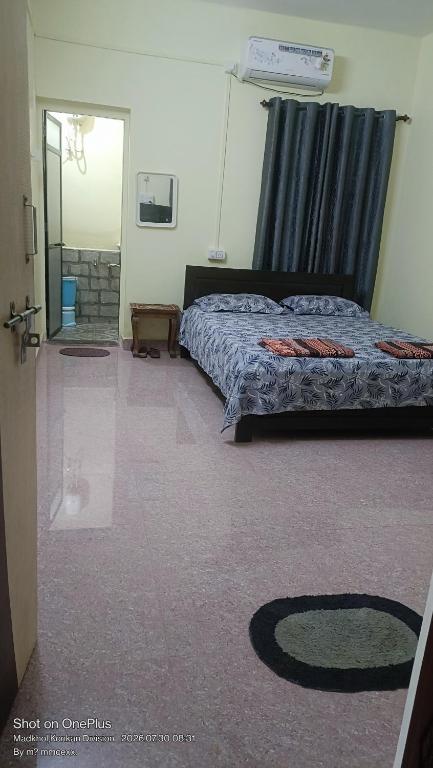 a bedroom with a bed in a room at Vitthal prema nivas in Sawantwadi