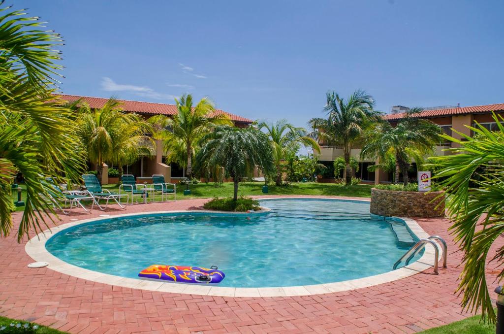 a swimming pool with a toy in the middle at Family-Flexication-Friendly Villa, few steps from Eagle Beach in Palm-Eagle Beach