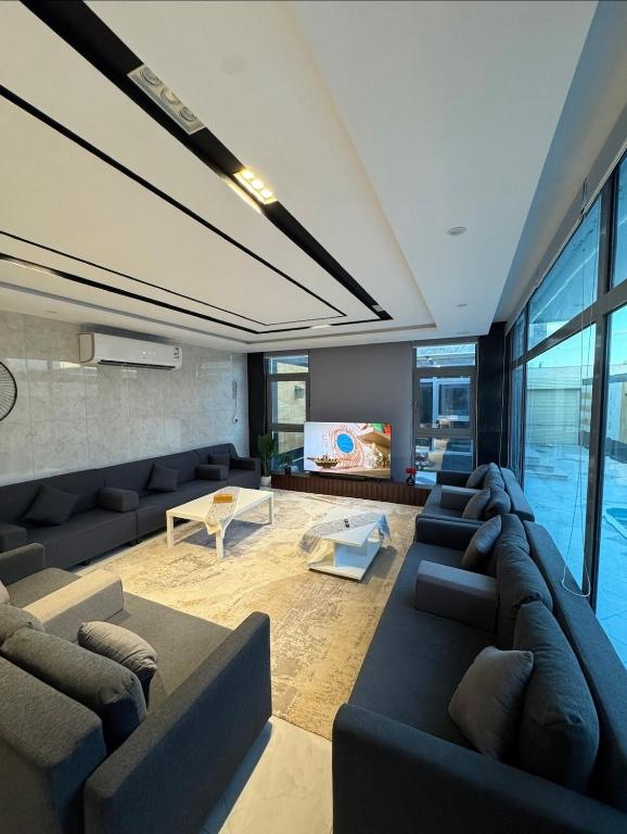 a living room with a couch and a tv at شاليه بيسان 1 in Jeddah