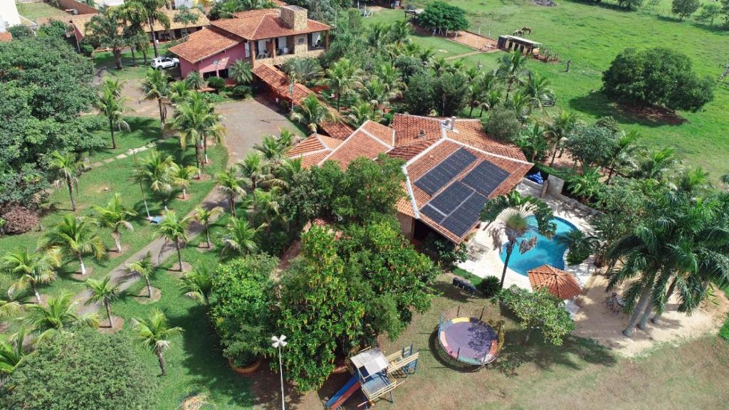 an aerial view of a house with a swimming pool at Pousada Tropical Vereda in Olímpia