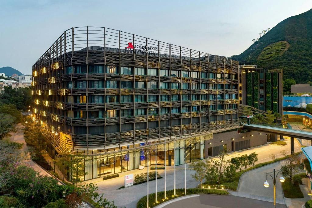 a rendering of a building with mountains in the background at Hong Kong Ocean Park Marriott Hotel in Hong Kong