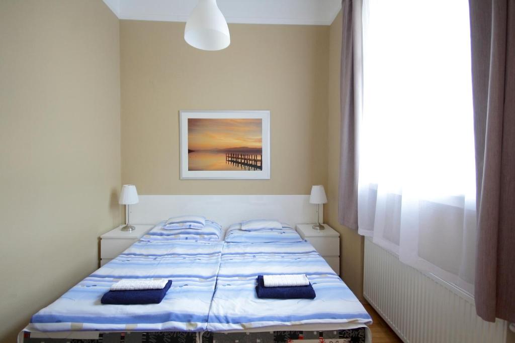 Posteľ alebo postele v izbe v ubytovaní City Centre Cosy Apartments