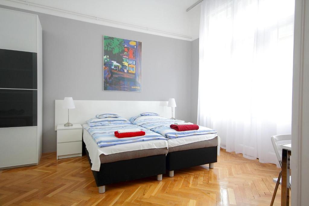 Posteľ alebo postele v izbe v ubytovaní City Centre Cosy Apartments