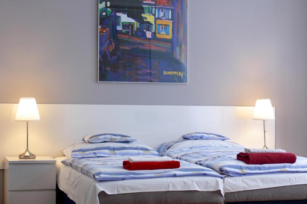 Posteľ alebo postele v izbe v ubytovaní City Centre Cosy Apartments