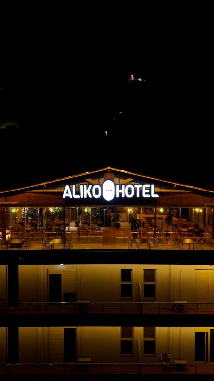 aallooco hotel is lit up at night at Aliko Hotel in Vlorë