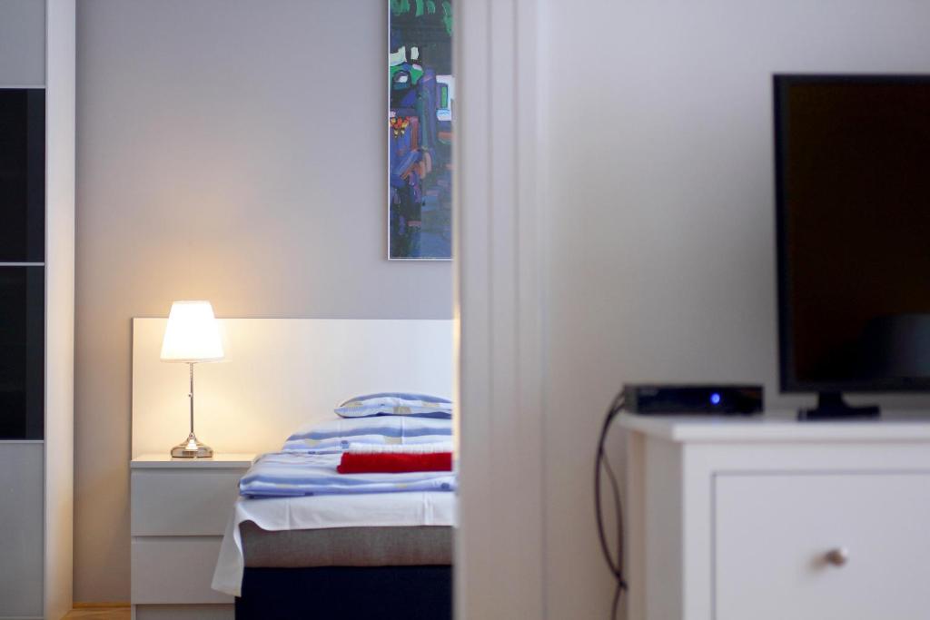 Posteľ alebo postele v izbe v ubytovaní City Centre Cosy Apartments