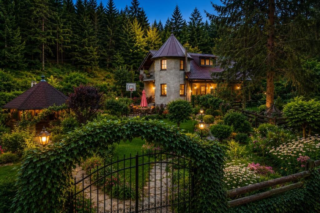 a home with an archway in front of a garden at Weekend house Grahovača in Rožaje